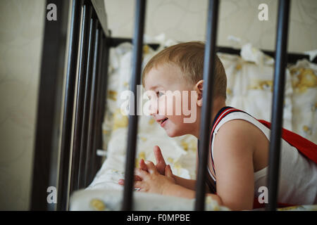 little boy in the cot Stock Photo