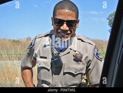 highway patrol officer makes traffic stop on California highway Stock Photo