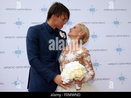 Moscow, Russia. 18th Aug, 2015. Two-time Olympic figure skating champions Maxim Trankov (L) and Tatiana Volosozhar during their wedding at the Rose Bar restaurant. Credit:  Vyacheslav Prokofyev/TASS/Alamy Live News