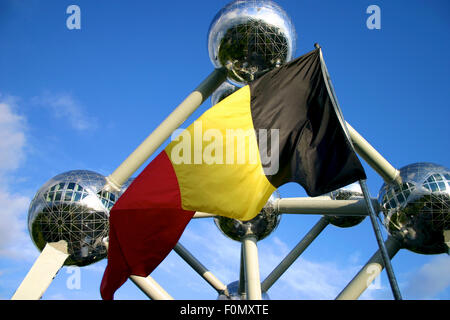 Atomium in Brussels with Belgian flag, Belgium Stock Photo