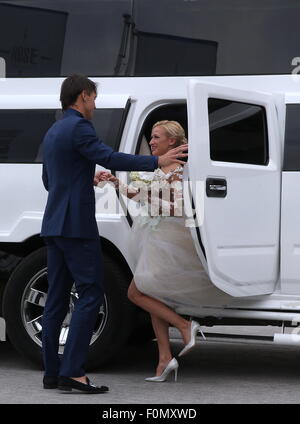 Moscow, Russia. 18th Aug, 2015. Two-time Olympic figure skating champions Maxim Trankov (L) and Tatiana Volosozhar step out of the car during their wedding at the Rose Bar restaurant. Credit:  Vyacheslav Prokofyev/TASS/Alamy Live News
