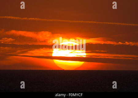 18th Aug, 2015. UK Weather: Sunset viewed from the deck of the Brittany Ferries M.V. Barfleur on its voyage to Poole in Dorset from Cherbourg in Normandy on Tuesday the 18th August 2015. Credit:  Chris Stevenson/Alamy Live News Stock Photo