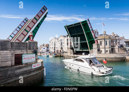 Weymouth Town Bridge, built in 1930, is a lifting bascule bridge allowing boats to access the inner harbour. Stock Photo