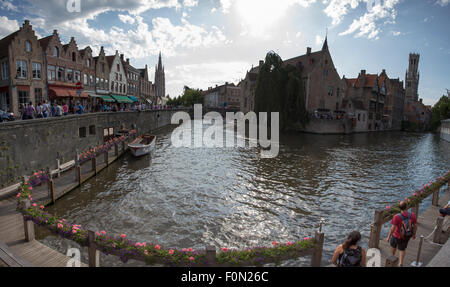 Unidentified people walking along the canals in the old and famous city centre of Bruges in Belgium. The historic city Stock Photo
