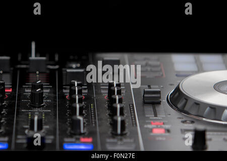 Audio mixer mixing board fader and DJ MP3 player with speed variator Stock Photo