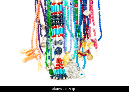 Close-up on very colourful handmade necklaces isolated by white background Stock Photo