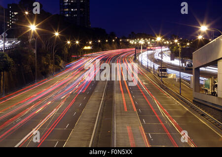 North Sydney, NSW, Australia - June 27th, 2015. Light trails of heavy traffic in North Sydney after a work day ends for some. Stock Photo