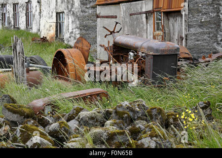 Abandoned farm equipment at Holmur Farm near Kirkjubæjarklaustur (Kirkjubæjarklaustri), southern Iceland Stock Photo