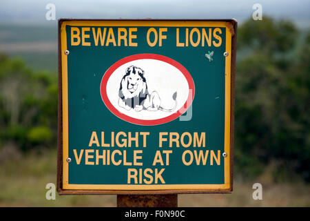 A wooden warning sign on a fence of a South African lion game park Stock Photo