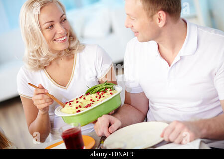 Happy married couple having dinner at home Stock Photo