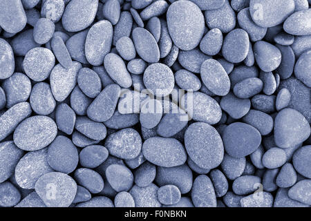 Natural pebble stone background. Slightly colorized in blue Stock Photo