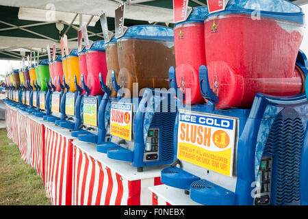 Slush drinks at a fair in the UK. Colourful iced frozen drinks. Stock Photo