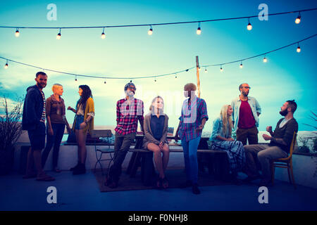 Diversity Sundown Beach Chatting Roof Top Fun Concept Stock Photo