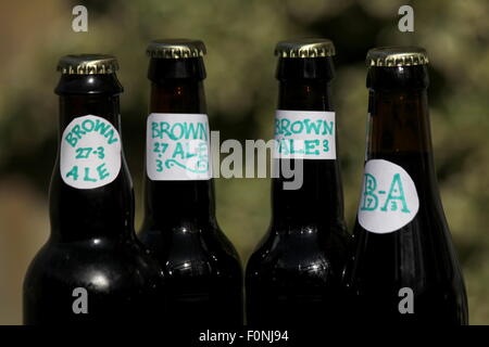 Home brewed brown ale with amateur labeling. Stock Photo