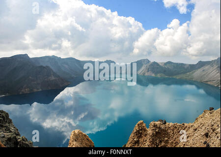 Changbai Mountain. 17th Aug, 2015. Photo taken on Aug. 17, 2015 shows the Tianchi Lake on the Changbai Mountain, northeast China's Jilin Province. The Changbai Mountain attracted 1.93 million tourists in 2014, up 23 percent year on year. Credit:  Xu Chang/Xinhua/Alamy Live News Stock Photo