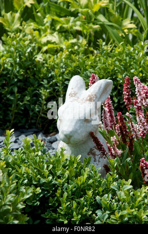 The White Rabbit figurine in the Mad Hatter's Tea Party themed garden at RHS Hampton Court Palace flower Show 2015 Stock Photo