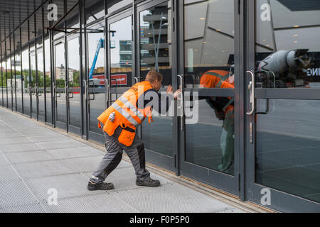 A man laws of a lock in the door Stock Photo