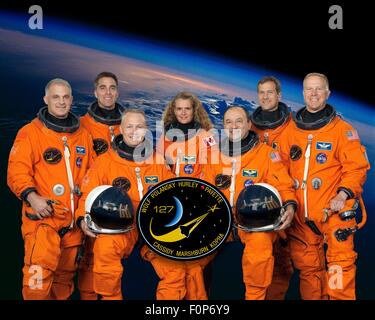 Group portrait of the STS-127 space shuttle crew astronauts in launch-and-entry suits are (L to R): Dave Wolf, Christopher Cassidy, Doug Hurley, Canadian Space Agency's Julie Payette, Mark Polansky, Tom Marshburn and Tim Kopra at the Johnson Space Center October 10, 2008 in Houston, Texas. Stock Photo