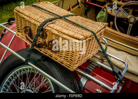 Back of open top MG sports car with wicker picnic basket Stock Photo
