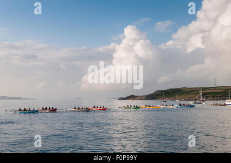 The start of a pilot gig race from Hugh Town, St Mary's to Tresco in beautiful evening light. Stock Photo