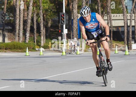 Committed Male Cyclist Competing In The Long Beach Triathlon. 16 August 2015. Stock Photo