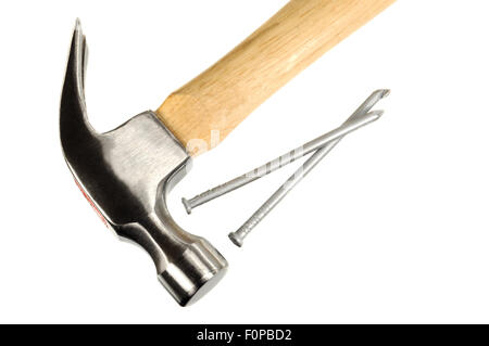 Macro shot of a hammer and nails isolated on a white background Stock Photo