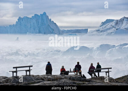 Icebergs piled up in the icefiord, calved from Sermeq Kujalleq glacier, Ilullisat, Disko Bay, West Greenland Stock Photo