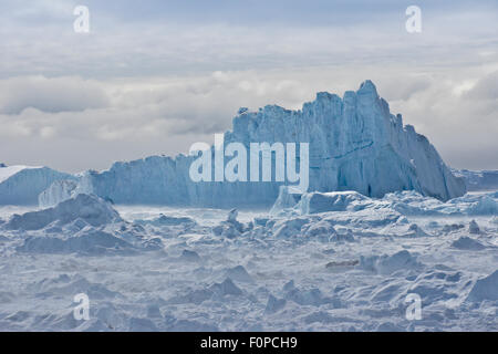 Icebergs piled up in the icefiord, calved from Sermeq Kujalleq glacier, Ilullisat, Disko Bay, West Greenland Stock Photo