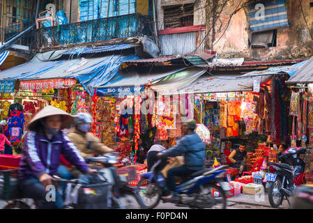 Vietnam street scene, view of traffic in a busy street in the historic Old Quarter of Hanoi, Vietnam. Stock Photo