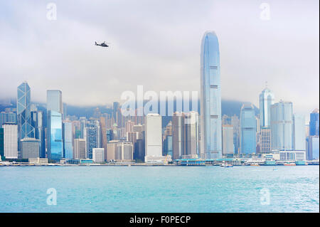 Flying helicopter above the Hong Kong downtown Stock Photo