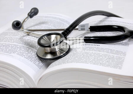 Stethoscope on the pages of a text book Stock Photo