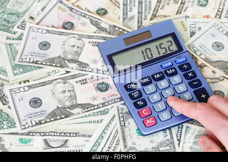 Financial background of dollar notes with a calculator Stock Photo
