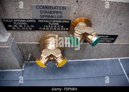 USA, New York State, New York City, Manhattan, Typical sprinkler valves on exterior of building in the financial district. Stock Photo