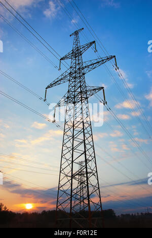 High voltage power line on blue sky background with clouds Stock Photo ...