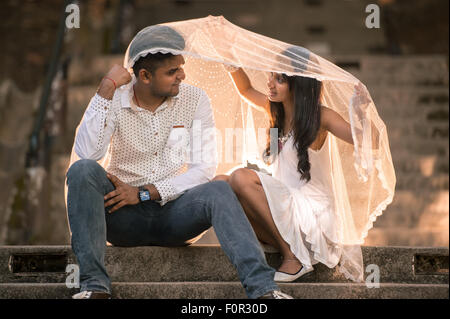 Asian Indian couple enjoying each other's company Stock Photo