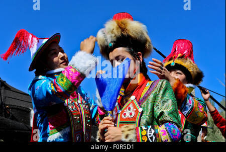 Yugur, Gansu, CHN. 18th Aug, 2015. Yugur, CHINA - August 18 2015: (EDITORIAL USE ONLY. CHINA OUTï¼‰Successor of Intagible Cultural Heritage Ke Cuilin held a wedding for her daughter, passing on the wedding heritage to the 90s youth on August 18 2015 morning. the Yugur ethnic minority group is heir of Uighur ethinic group, and divided as Western Yugur and Eastern Yugur mainly in Yugur Autonomous County Gansu. In 2011 their traditional wedding customs were on the 3rd National Intagible Cultural Heritage List. They insist monogamy, men and women share same Family name and same origin, or differe Stock Photo