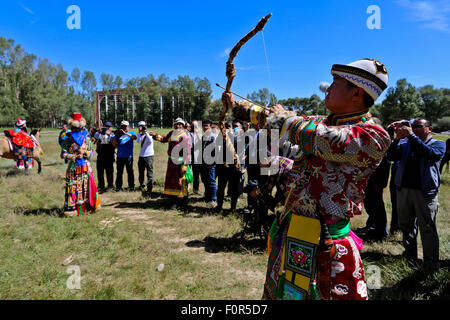 Yugur, Gansu, CHN. 18th Aug, 2015. Yugur, CHINA - August 18 2015: (EDITORIAL USE ONLY. CHINA OUTï¼‰Successor of Intagible Cultural Heritage Ke Cuilin held a wedding for her daughter, passing on the wedding heritage to the 90s youth on August 18 2015 morning. the Yugur ethnic minority group is heir of Uighur ethinic group, and divided as Western Yugur and Eastern Yugur mainly in Yugur Autonomous County Gansu. In 2011 their traditional wedding customs were on the 3rd National Intagible Cultural Heritage List. They insist monogamy, men and women share same Family name and same origin, or differe Stock Photo