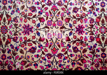 pattern background, antique worn oriental carpet with floral stylized texture Stock Photo