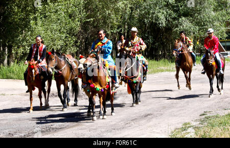 Yugur, Gansu, CHN. 18th Aug, 2015. Yugur, CHINA - August 18 2015: (EDITORIAL USE ONLY. CHINA OUTï¼‰Successor of Intagible Cultural Heritage Ke Cuilin held a wedding for her daughter, passing on the wedding heritage to the 90s youth on August 18 2015 morning. the Yugur ethnic minority group is heir of Uighur ethinic group, and divided as Western Yugur and Eastern Yugur mainly in Yugur Autonomous County Gansu. In 2011 their traditional wedding customs were on the 3rd National Intagible Cultural Heritage List. They insist monogamy, men and women share same Family name and same origin, or differe Stock Photo