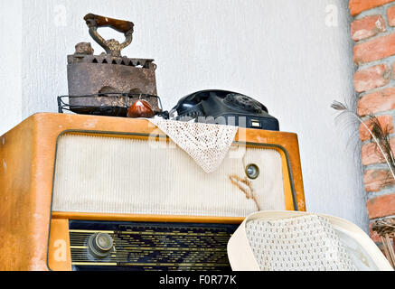 Old time radio iron and telephone evokes memories for the past Stock Photo