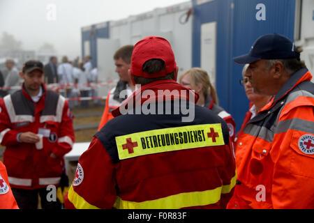 Rendsburg, Germany. 20th Aug, 2015. Medical staff stand in front of the primary health care centre that is currently placed in containers in Rendsburg, Germany, 20 August 2015. More than 60 doctors and nurses from the university hospitals in Kiel and Luebeck started their voluntary service to take care of the refugees in the new reception centre. Photo: CARSTEN REHDER/dpa/Alamy Live News Stock Photo