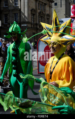 Theatre group in unusual colourful costumes promoting their show at the Edinburgh Festival Fringe in 2015. Stock Photo