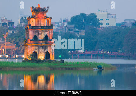 Hanoi Turtle Tower, view at dusk of the 19th century pavilion known as Turtle Tower sited in Hoan Kiem Lake in the center of Hanoi, Vietnam.