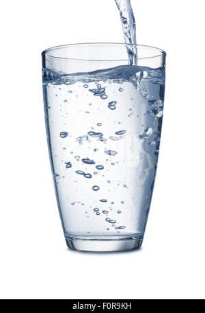 Water puring into glass isolated on white with clipping path Stock Photo