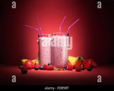 Fruit smoothies with fruit in glass with straws Stock Photo