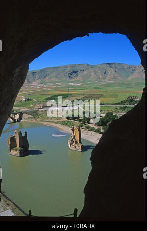 Ancient bridge seen from the citadel now flooded by the Ilisu Dam, Hasankeyf on the Tigris river, Batman Province, southeast Turkey Stock Photo