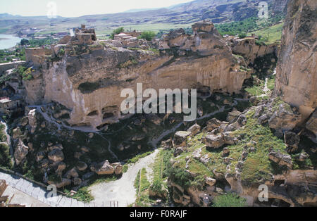 Ancient cave dwellings seen from the citadel now flooded by the Ilisu Dam, Hasankeyf on the Tigris river southeast Turkey Stock Photo