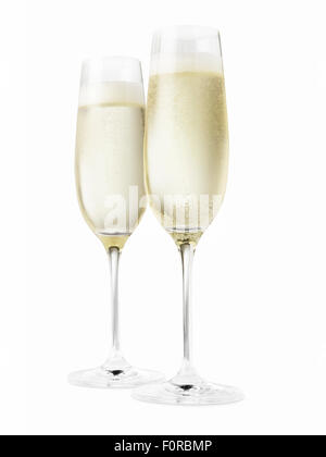 Studio shot of two champagne glasses isolated on a white background. Please note the chilled nature of the liquid has created co Stock Photo