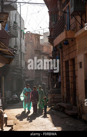 Jodhpur, India. Street scene with three women in saris and a boy. Stock Photo