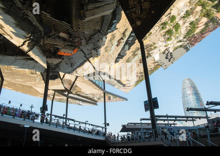 AGBAR tower and mirrored ceiling of Els Encants open-air flea market, vendors and second-hand goods, Barcelona, Spain Stock Photo